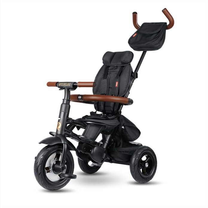 Tricicleta pentru copii QPlay Rito Deluxe maro, pliabila, cu scaun inalt, matlasat, ajustabil in 2 pozitii, maner cu control al directiei, frana dubla, copertina XXL, detalii de piele ecologica
