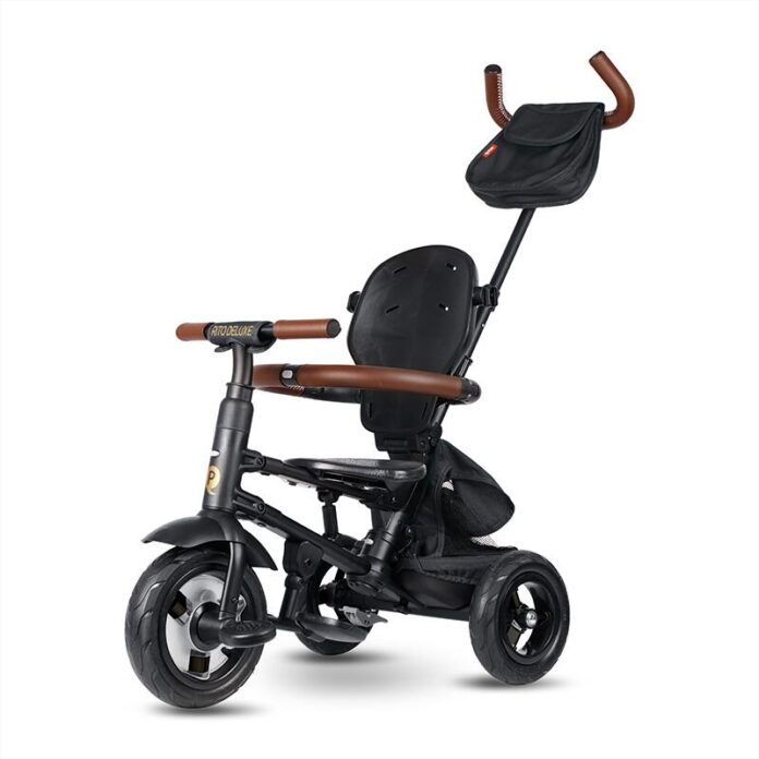 Tricicleta pentru copii QPlay Rito Deluxe maro, pliabila, cu scaun inalt, matlasat, ajustabil in 2 pozitii, maner cu control al directiei, frana dubla, copertina XXL, detalii de piele ecologica